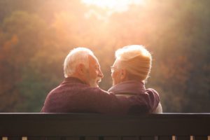 Older couple sat on bench image for Power of Attorney blog
