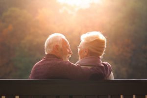 Older couple sat on bench image for Power of Attorney blog
