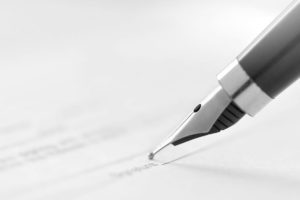 Fountain pen signing document image for increase in will writing during the global pandemic blog