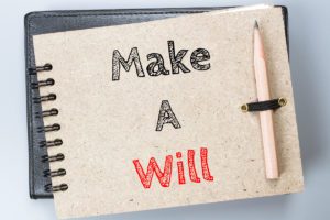 Make a will written on notepad image for make a will checklist blog