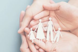 Paper cut out family being cupped in hands image for blog on what happens if a person dies without a will
