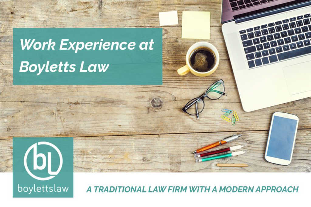 Image of a laptop, phone and cup of coffee on a wooden table for work experience blog